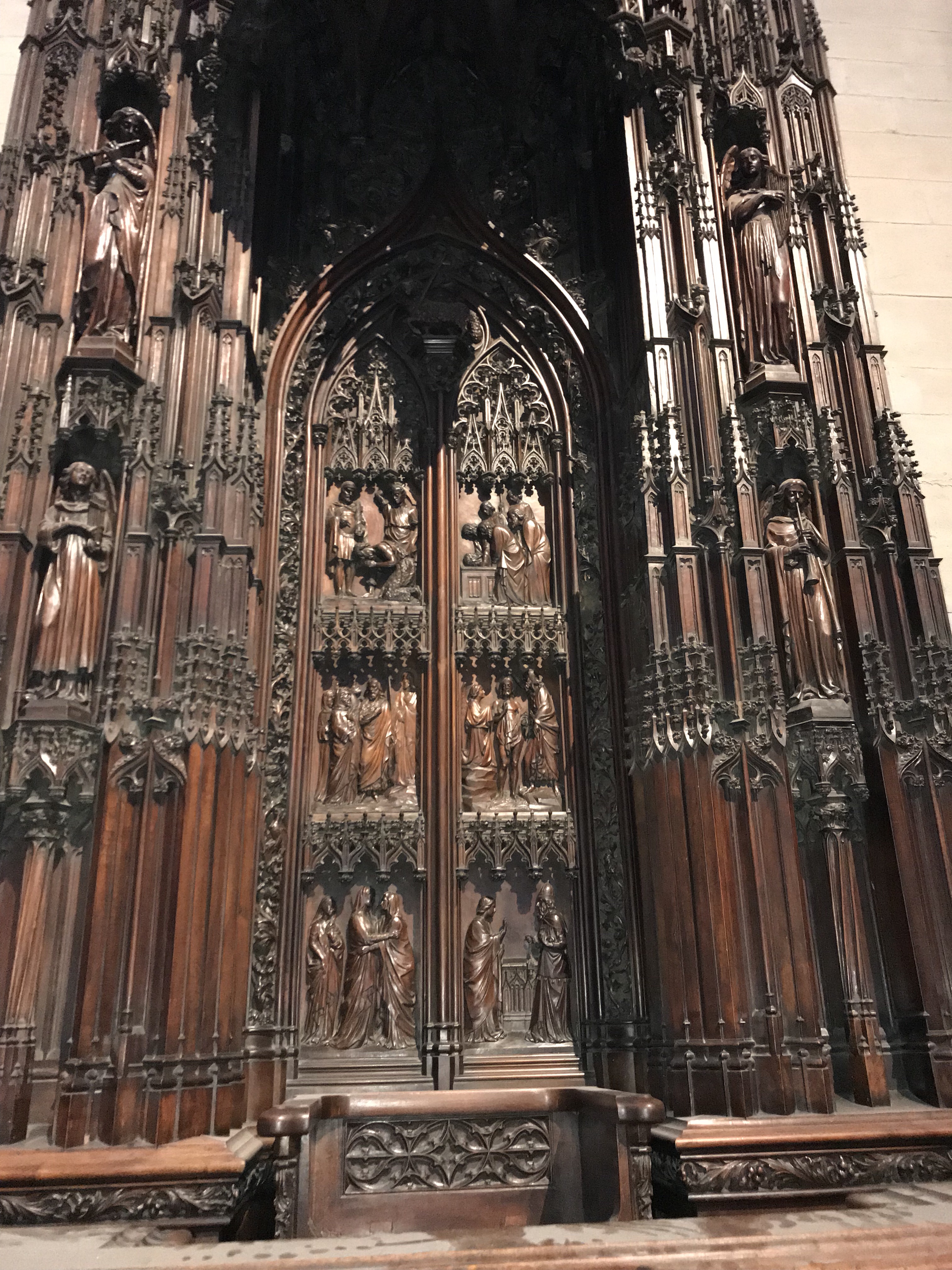 Carved wood piece from Lyon Cathedral. The panels on the doors in the center appear to depict the list of John the Baptist